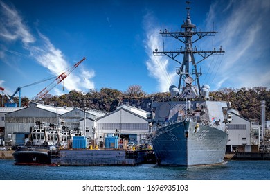 Yokosuka, Kanagawa / Japan – March 12, 2020:  The USS John S. McCain (DDG-56), An Arleigh Burke-class Guided Missile Destroyer, Sits At The Dock.