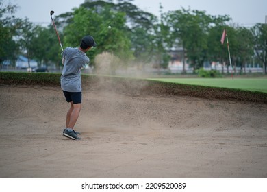 Yong Asian Golfer Explosion Sand.
