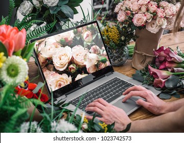 Yong florist using interface of online flower shop - Powered by Shutterstock