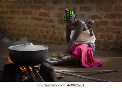 Yongoro, Sierra Leone - June 03, 2013: West Africa, The Village Of Yongoro In Front Of Freetown,in Front Of His House Preparing Food For The Family