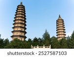 Yongzuo Temple, also known as the Twin Pagodas Temple, Taiyuan, Shanxi, China, Asia, with blue sky, white clouds and sunlight illuminating the tall towers