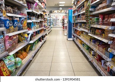 York / Great Britain - March 29, 2019 : Grocery Store Aisle Showing Crips, Biscuits And Snacks.  Nobody In Shot