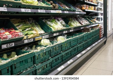 York / Great Britain - March 29, 2019 : Grocery Store Aisle Showing Vegetables On Display.  Nobody In Shot