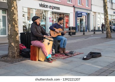 York / Great Britain - March 29, 2019 : Street Performers Busking Playing Music On The Street With Drum And Guitar