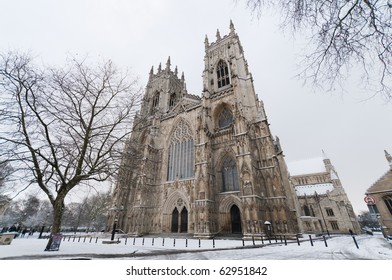 York Minster on a cold winter morning, with snow on the ground. Viewed from the western front.