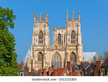 York Minster towering above some houses.