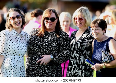 YORK RACECOURSE, NORTH YORKSHIRE, UK : 8 October 2021 : A Group Of Ladies Laugh And Enjoy The Social Occasion And Atmosphere At York Races