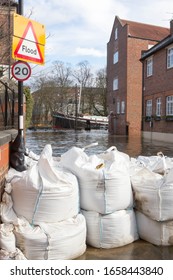 YORK, UK 26 FEBRUARY 2020.Sandbags protecting property from the flooded River Ouse in the centre of York, United Kingdom.