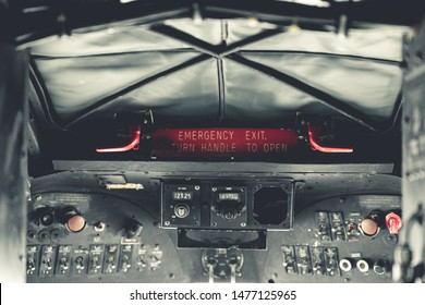 YORK, UK - 6TH AUGUST 2019: WW2 Douglas Dakota IV C-47B Cockpit With Message Emergency Exit Turn Handle To Open Sign