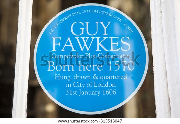 YORK, UK -\
AUGUST 25TH 2015: A blue plaque sticker at Guy Fawkes Inn marking\
the location where Guy Fawkes was born in York, on 25th August\
2015.  Guy Fawkes was born in\
1570.