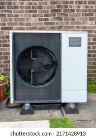 York, UK - June 25 2022: Mitsubishi Ecodan Air Source Heat Pump Installed Beside A Brick House Wall