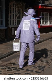 York, UK - March 11, 2022: Purpleman Walking In Slow Motion Along The Shambles, York To Raise Money For The Ukrainian People.