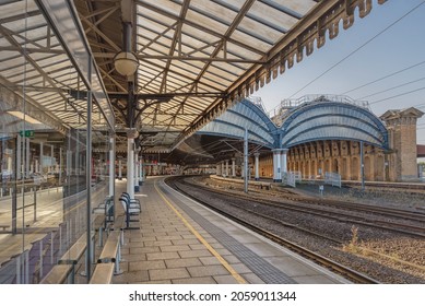 York, UK.  October 15, 2021. View Of A Railway Station With Historic Canopies And A Mirror Image Or A Platform Reflected In A Waiting Room Glass Wall.  A Metal And Glass 19th Century Canopy Is Above.