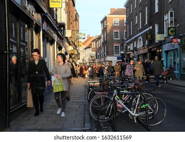 York, Yorkshire, England, UK.  January 22, 2020.  People Shopping In The Late Winter Sunlight In Church Street.