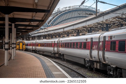 YORK, YORKSHIRE UK - OCTOBER 21 2018: Train waiting at York station showing famous Victorian arches - Powered by Shutterstock