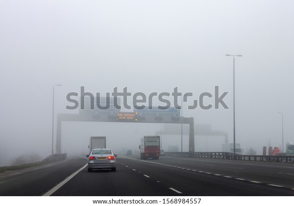 Yorkshire. England.\
02.11.08. Poor visibility, hazardous conditions - Winter driving in\
fog on a British\
motorway.