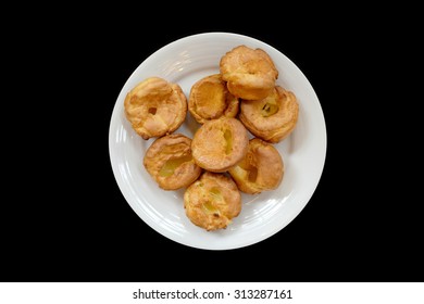 Yorkshire Pudding On A White Plate, Black Background Isolated, From Above