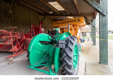 York.Yorkshire.United Kingdom.February 16th 2022.A Ransomes threshing machine connected to a green fordson tractor is on display at the Yorkshire museum of farming