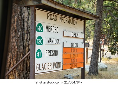 Yosemite, CA - July 14, 2022: A road information side inside Yosemite National Park shows Highway 41 being closed because of the Washburn Fires.  Glacier Point is closed for construction.