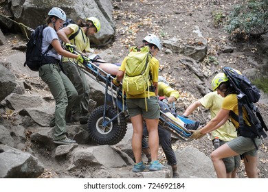 Yosemite National Park, California - September 4, 2017: Emergency Medical Service Workers Rescue A Female Tourist