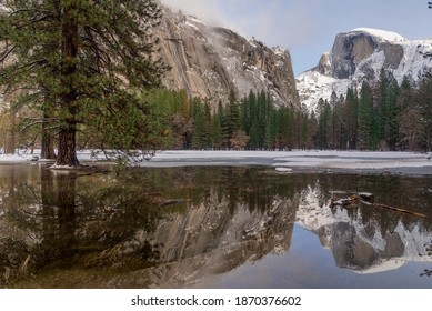 Yosemite National Park reflections in winter showing Half Dome and beautiful trees
