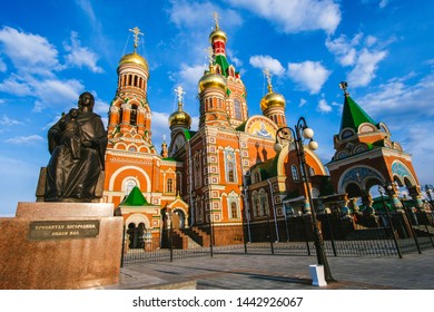 Yoshkar-Ola city, Republic of Mari El, Russia - May, 2019: View of the Cathedral of the Annunciation of the Blessed Virgin Mary with a monument