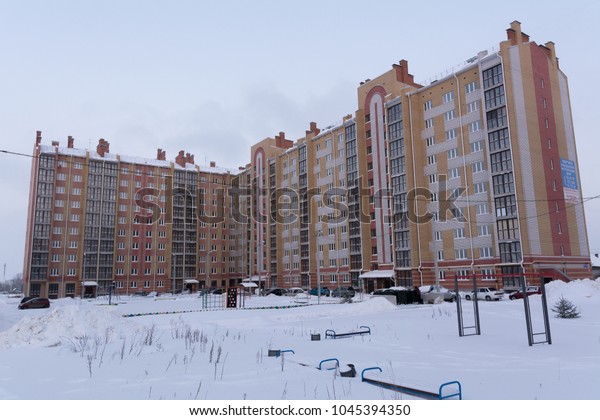 Yoshkar-Ola, Russia\
- January 25, 2018 A multi-storey brick house in a residential area\
in the winter\
season
