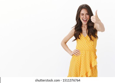 You awesome believe yourself. Self-assured empowered sassy brunette woman show thumb-up hinting awesome idea, like your choice, wink flirty and laughing happy, agree excellent pick