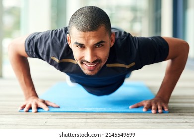 If you believe you can, then you will. Portrait of a sporty young man doing pushups outside.