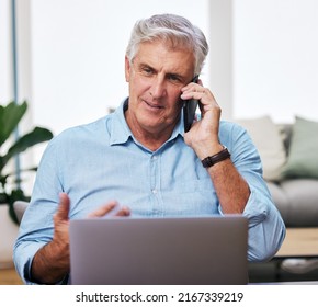 You Can Call Me At Any Time. Shot Of A Mature Man Using His Cellphone And Laptop While Working From Home.