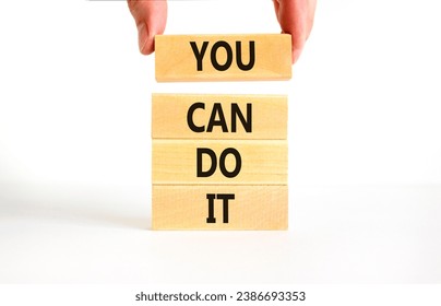 You can do it symbol. Concept word You can do it on beautiful wooden block. Beautiful white table white background. Businessman hand. Business motivational you can do it concept. Copy space.