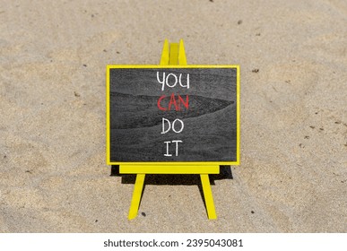 You can do it symbol. Concept word You can do it on beautiful black chalk blackboard. Beautiful sand beach background. Business motivational you can do it concept. Copy space. - Shutterstock ID 2395043081