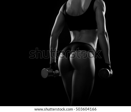 You too can do this. Horizontal rearview shot of a female bodybuilder showing off her backside muscles at studio monochrome shot copyspace