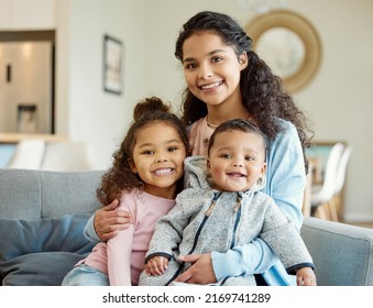 You Can Have It All. Shot Of A Young Mother Bonding With Her Kids On The Sofa At Home.