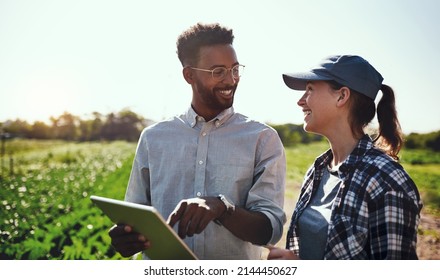 You did all this. Cropped shot of two young farmers looking at a tablet while working on their farm. - Powered by Shutterstock