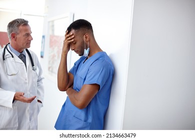 You Did Everything You Could. Shot Of A Doctor And A Surgeon Having A Difficult Conversation.