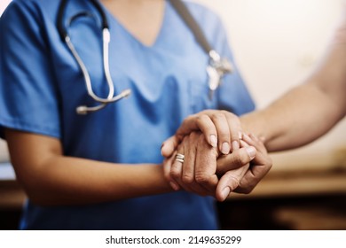 You dont have to face your challenges alone. Cropped shot of an unrecognizable female nurse holding a senior womans hands in comfort. - Powered by Shutterstock