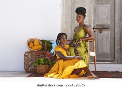You are enough to drive a king to his knees. Shot of two beautiful women posing outside.