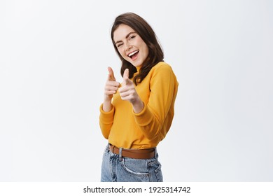 You Got This. Friendly Smiling Woman Congrats, Pointing At Camera And Smiling, Praising Good Jog, Inviting To Event, Standing On White Background.