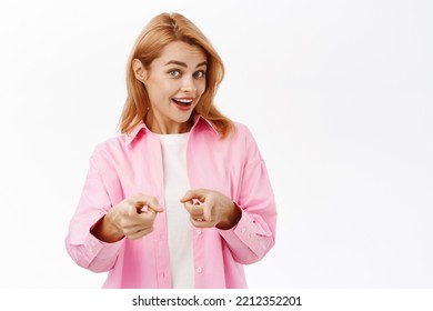 You Got This. Smiling Young Woman Pointing Fingers At Camera, Congratulating, Praising You, Standing Over White Background