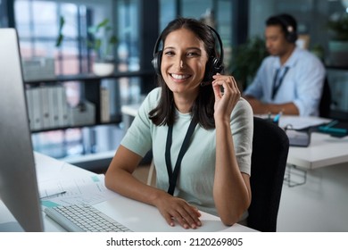 You havent heard quality until youve called us. Portrait of a young woman using a headset and computer in a modern office. - Shutterstock ID 2120269805
