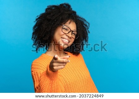 It's you. Joyful african american girl point finger at you happy smiling. Black student female in glasses choosing you. Headhunting and human resources, job position offer, career development concept
