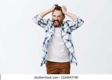 You Make Me Man. Portrait Of Stressed Intense And Bothered Crazy Bearded Man, Pulling Hair Out Of Head And Screaming From Anger And Negative Emotions, Yelling, Being Pissed And Fed Up Of Everything