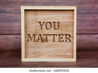 You Matter Text Engraved On Wooden Frame. Inspirational Concept.