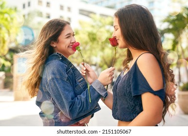 You My Favourite Person In The Whole World. Cropped Shot Of Two Female Best Friends Being Smelling Roses In The City.