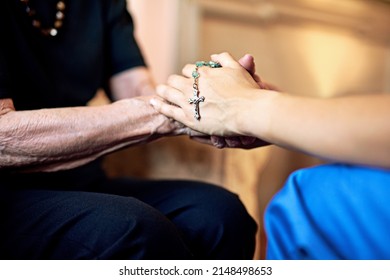 If You Need A Prayer, Know That Im Here. Cropped Shot Of A Person Compassionately Holding A Rosary And An Elderly Womans Hands.