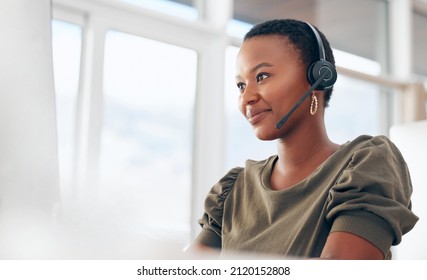 If you need us, call. Shot of a woman wearing a headset while working in a call centre. - Shutterstock ID 2120152808