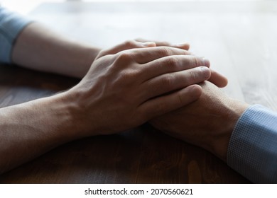 You are not alone daddy. Close up of young man hands covering wrinkled palms of mature old man grandfather help in difficult life situation. Compassionate grown son support father retiree in crisis - Shutterstock ID 2070560621