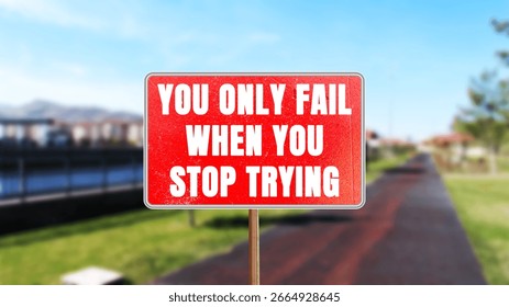 You Only Fail When You Stop Trying message written on red road sign. Conceptual You Only Fail When You Stop Trying symbol. Copy space.