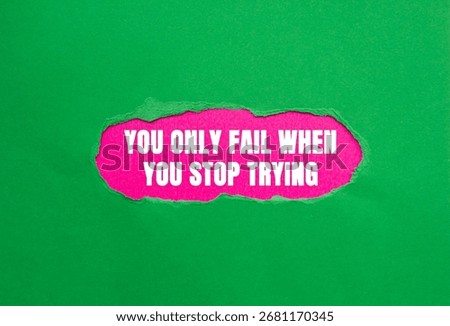 You Only Fail When You Stop Trying message written on ripped torn green paper on pink background. Conceptual You Only Fail When You Stop Trying symbol. Copy space.